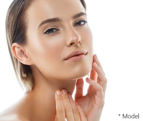 Beautiful model Girl with Perfect Fresh Clean Skin hand touching face